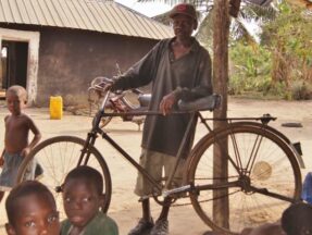 Village elder with bike