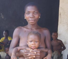 Young village woman with her baby